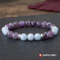Amethyst and aquamarine beaded bracelet with silver rondelle spacers on slate