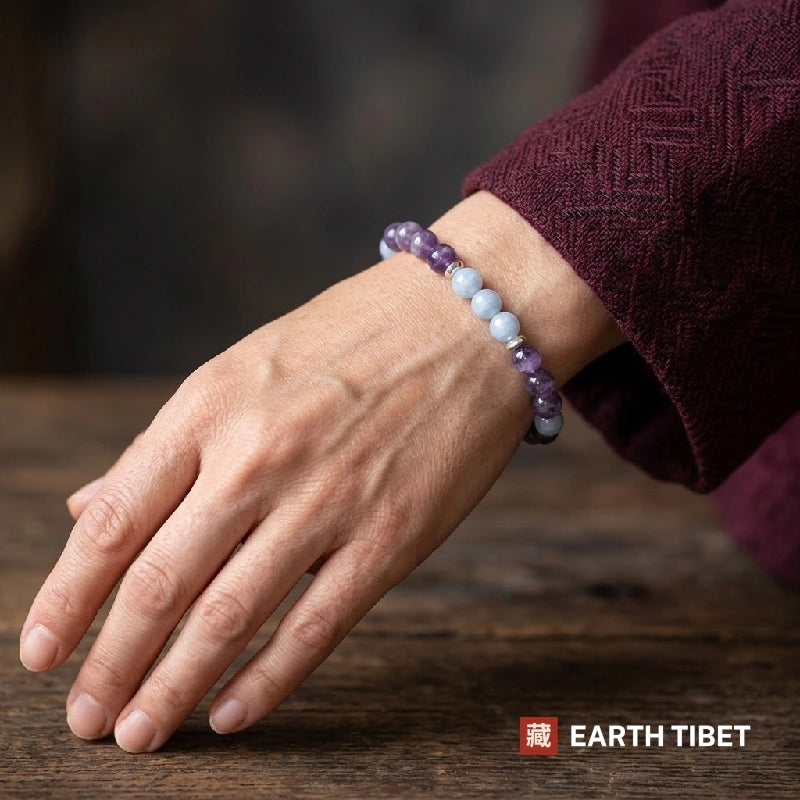 Woman wearing the amethyst aquamarine calming bracelet on her wrist