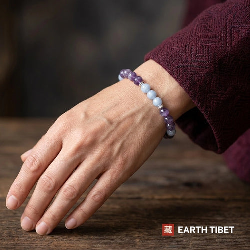 Woman wearing the amethyst aquamarine calming bracelet on her wrist