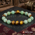 Aventurine tiger eye luck bracelet showing the chatoyant band of light across the tiger's eye beads