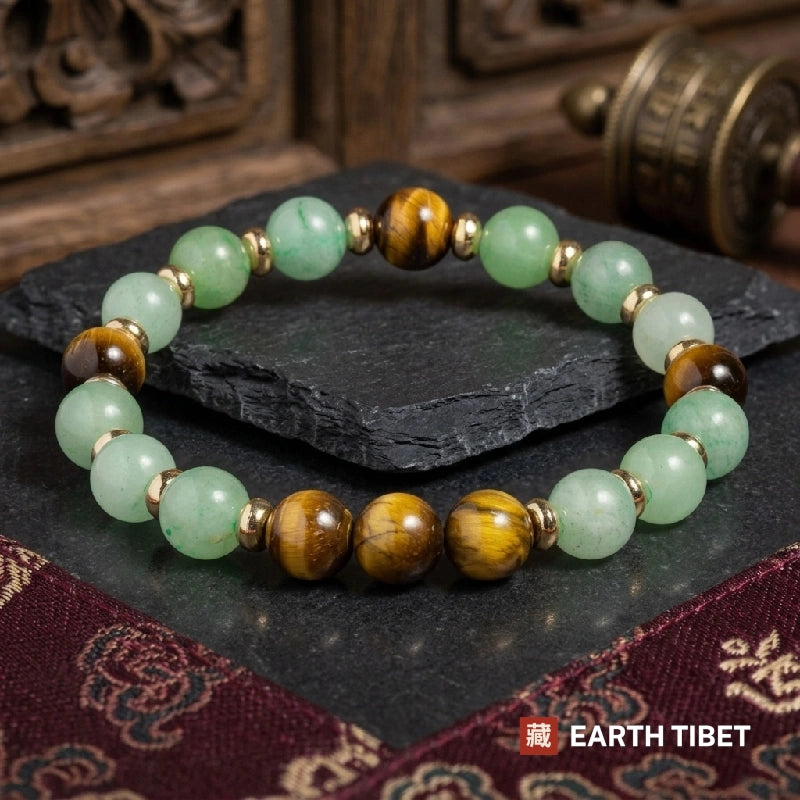 Green aventurine and tiger's eye beads separated into blocks by gold-toned rondelle spacers