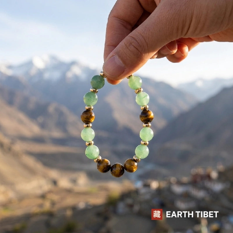 Full circle of the 8mm aventurine and tiger's eye luck bracelet on dark stone