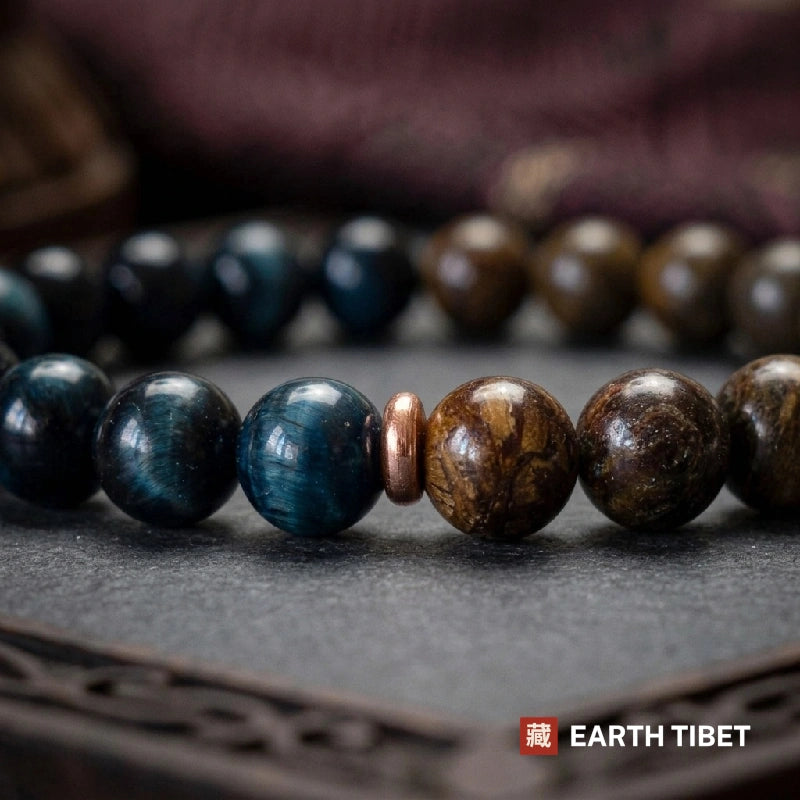 Close up of the chatoyant banding in blue tiger's eye beside the metallic glint of bronzite