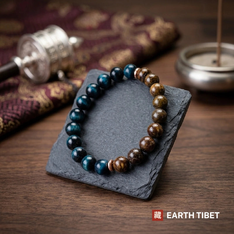 Blue tiger eye focus bracelet showing the cold and warm halves divided by copper rondelles