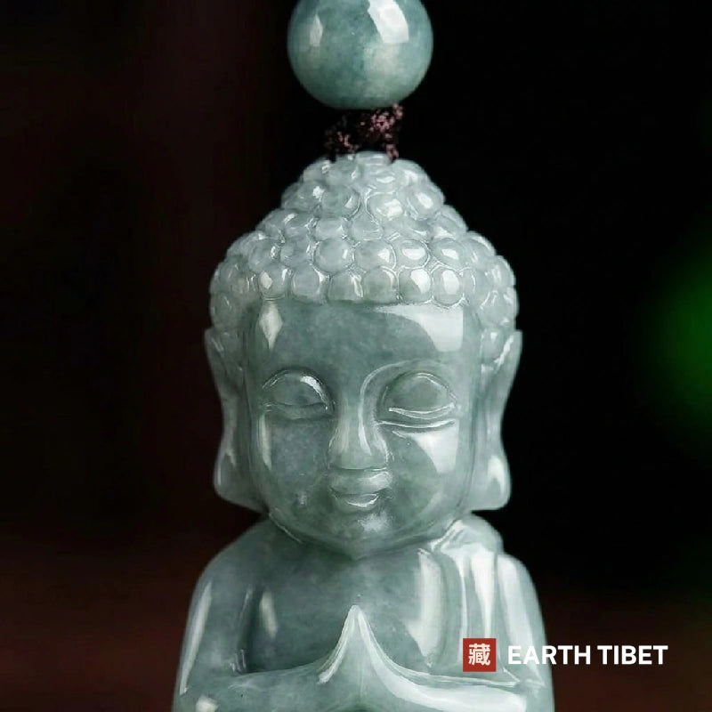 Detail of the jadeite Buddha pendant and the matching jade bead on the cord