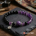 Charoite, amethyst and black obsidian stretch bracelet on slate