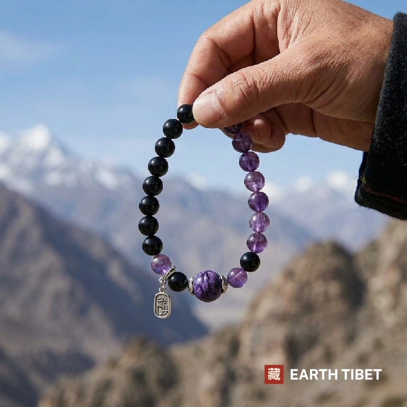 Charoite bracelet held up against snow-capped mountains