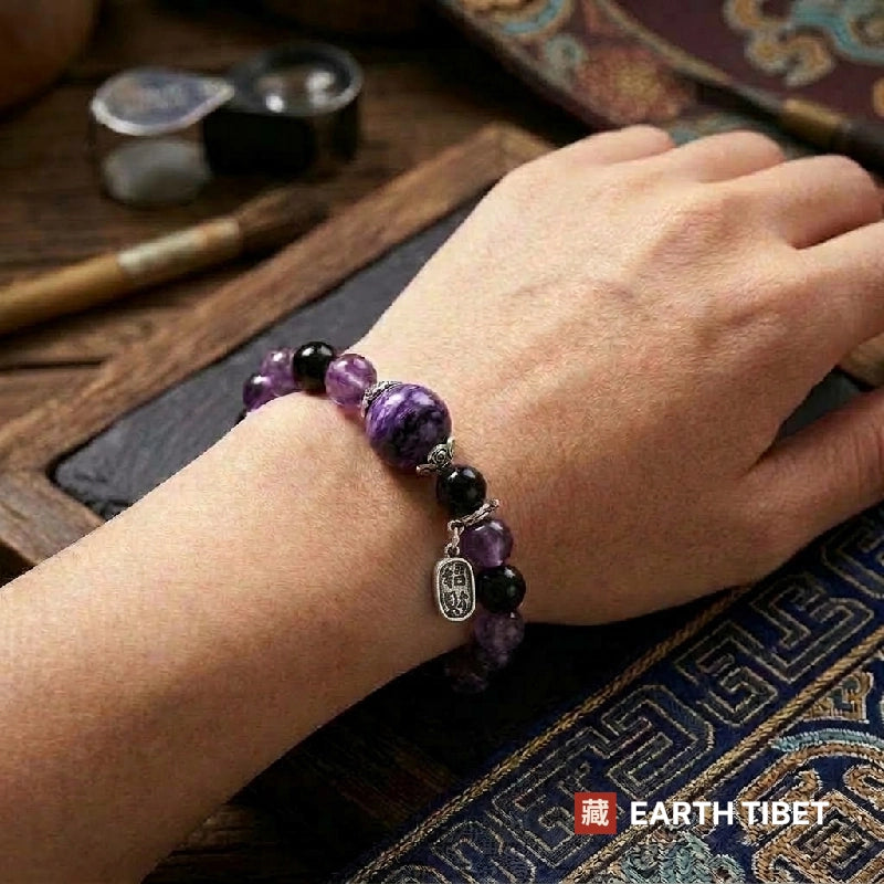 Charoite amethyst bracelet worn on a wrist