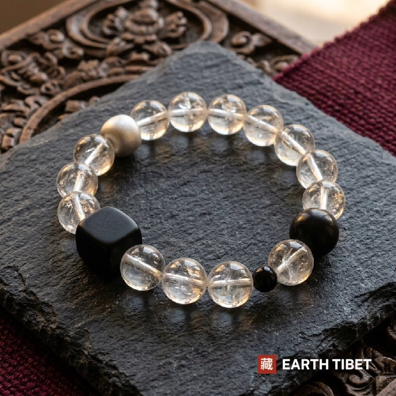 Full loop of the clearing and grounding bracelet showing the ebony cube and obsidian beads