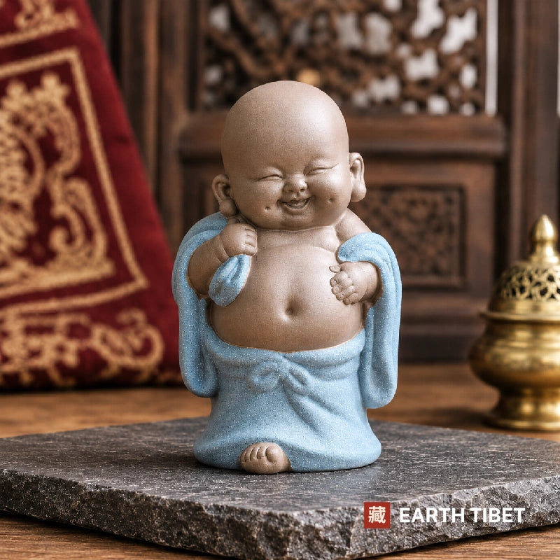 Standing baby laughing Buddha in a blue robe showing his belly