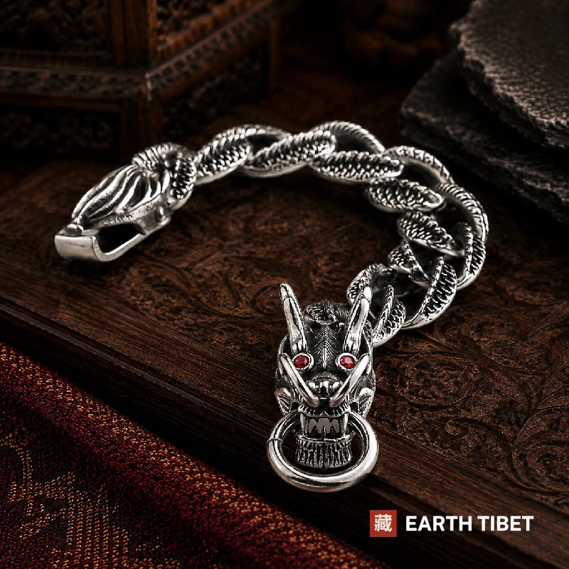 Dragon scale bracelet in stainless steel with a dragon head toggle and red stone eyes