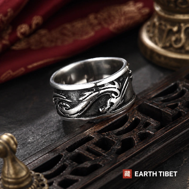 Dragon band ring on a dark surface showing the width of the band