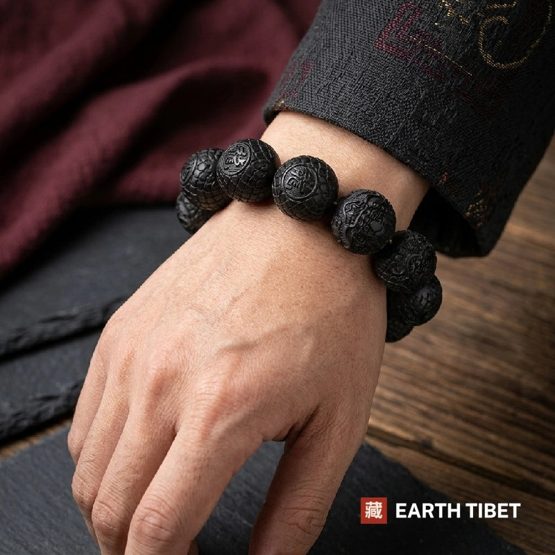 Man wearing the chunky 20mm ebony dragon bracelet on his wrist