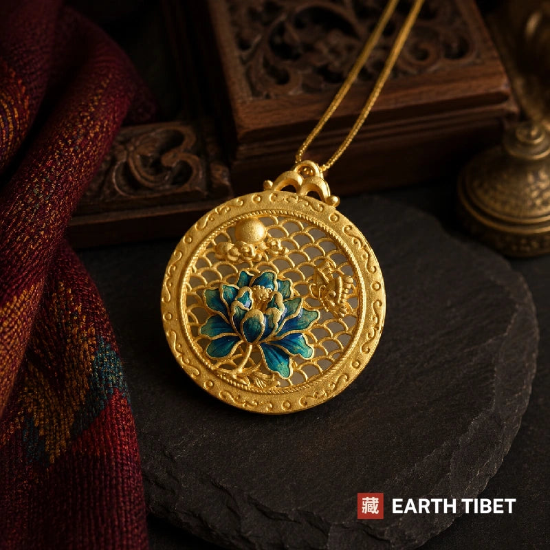 Gold openwork lotus pendant with a blue flower over a fish-scale lattice