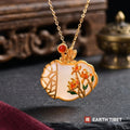 White agate ruyi lock necklace with enamel chrysanthemums and a gold garden lattice, on a gold plated silver chain