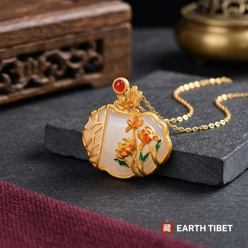 Chrysanthemum white agate pendant resting on slate, showing the ice-crack lattice panel and enamel flowers