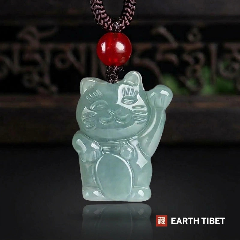 Translucent grade jadeite fortune cat pendant, icy and pale, left paw raised