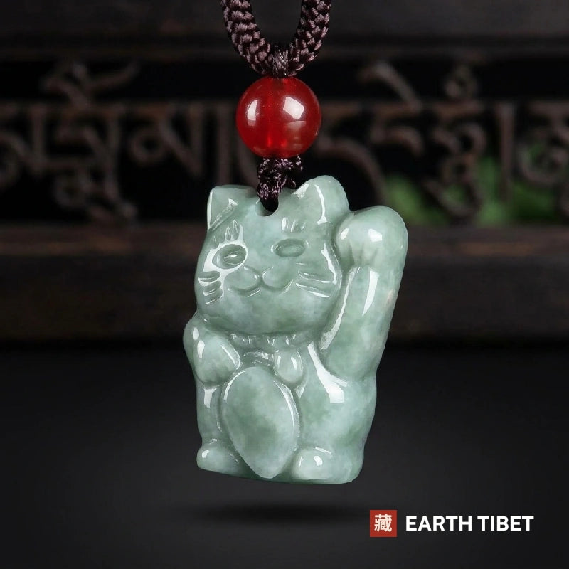 Opaque grade jadeite fortune cat pendant showing the coin held in its lap