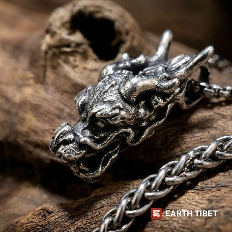 Close profile of the dragon head showing curling whiskers, mane and deer antlers