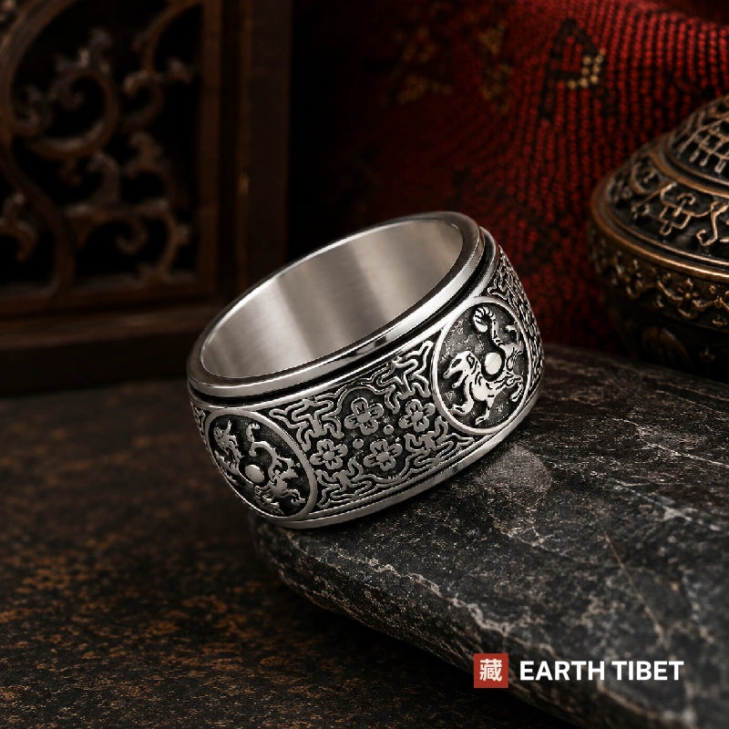 Four Guardians spinner ring in Tibetan silver, medallions and flowered lattice around a wide band