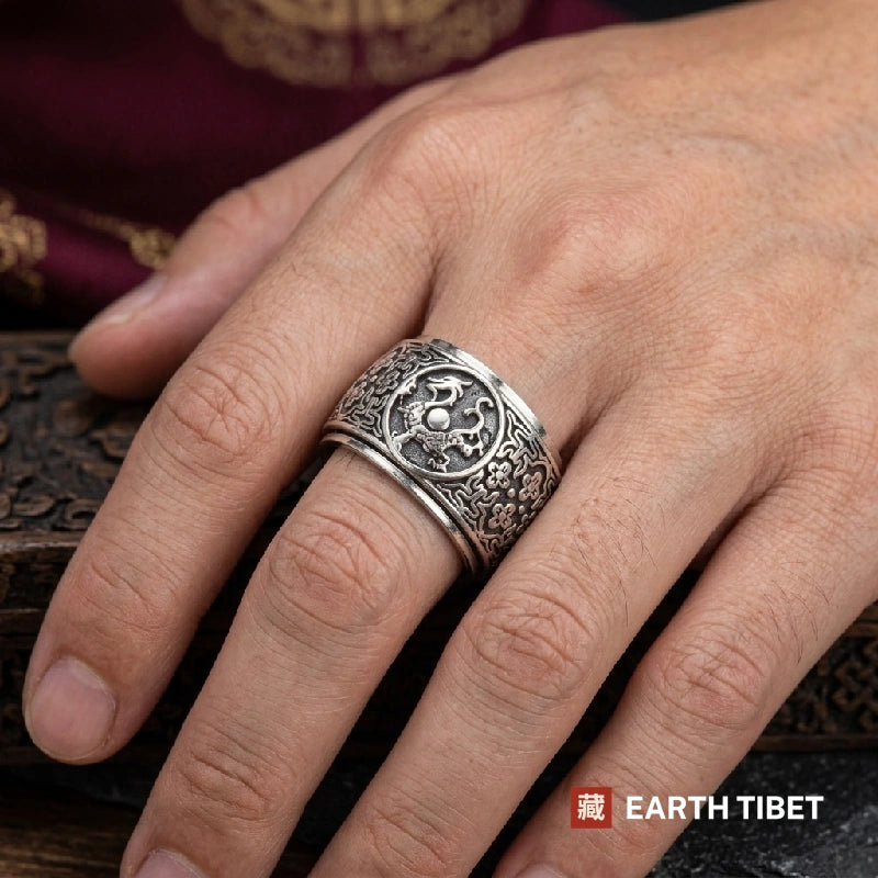 Four Guardians spinner ring worn on the hand, showing the width of the band
