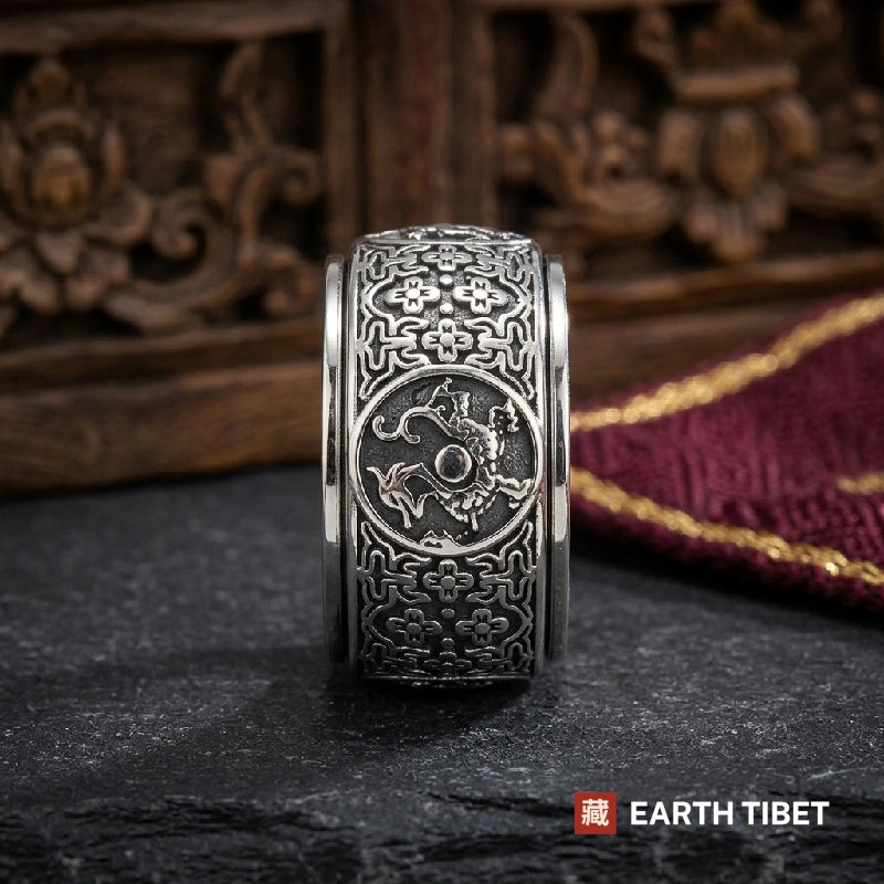 Guardian medallion on the spinner ring, a creature chasing a pearl inside a circle
