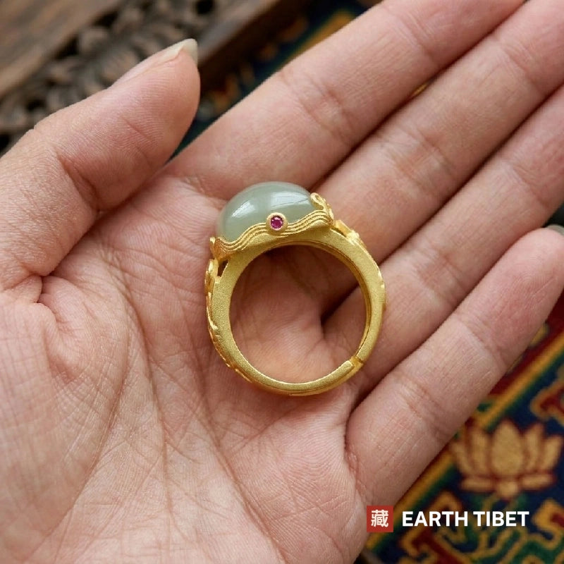 Ring held in a palm showing the band open at the back for adjustment