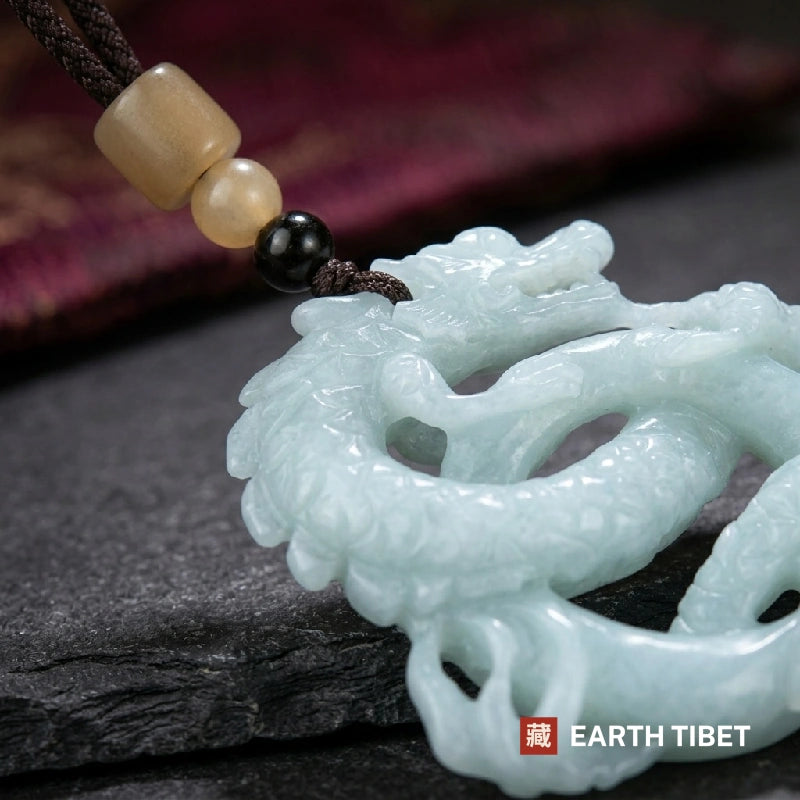 Close up of the braided cord, cream and black bead stack and the jade dragon's head