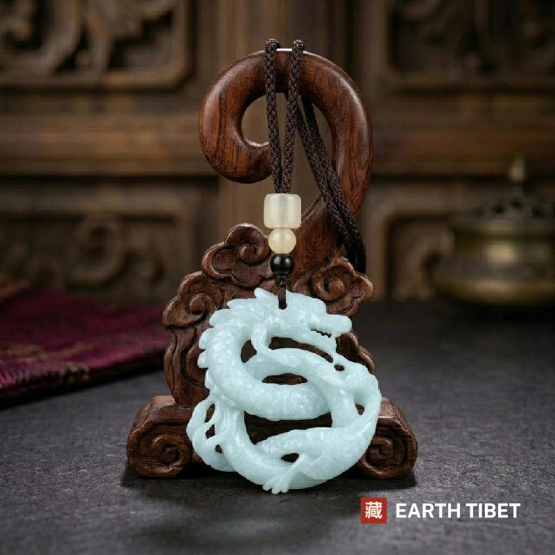 Guardian jade dragon protection necklace displayed on a carved wooden stand