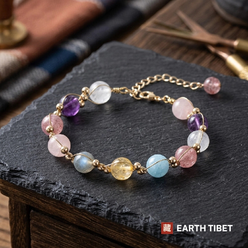 Pastel crystal bracelet with gold wire wrapped beads on slate