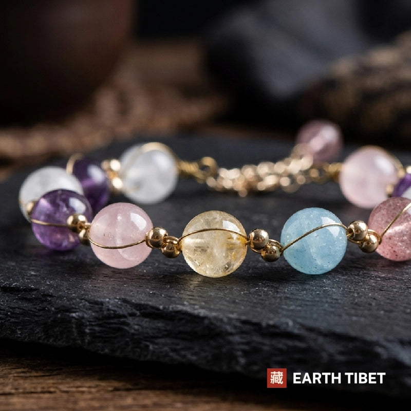 Close view of the citrine, aquamarine and rose quartz beads in their gold wire wraps