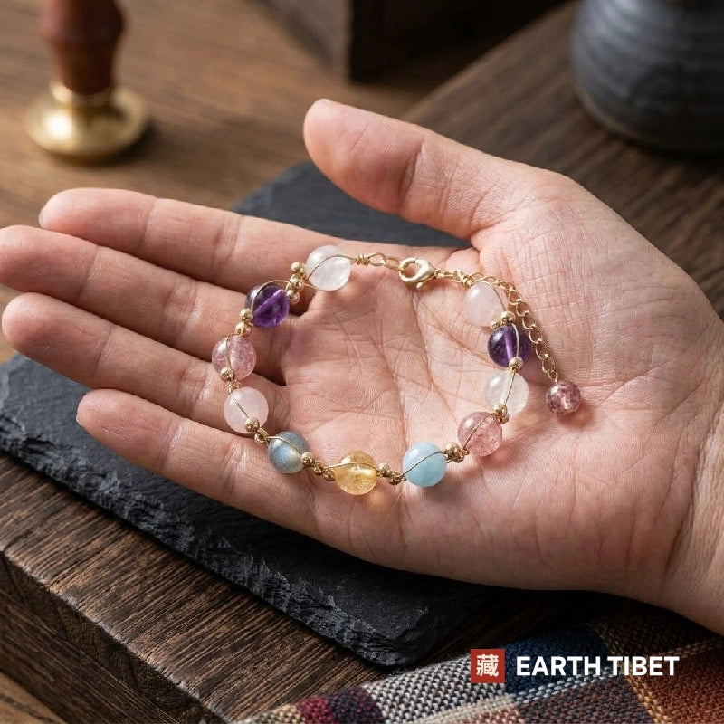 Harmony bracelet lying in an open hand, showing the clasp and extender chain