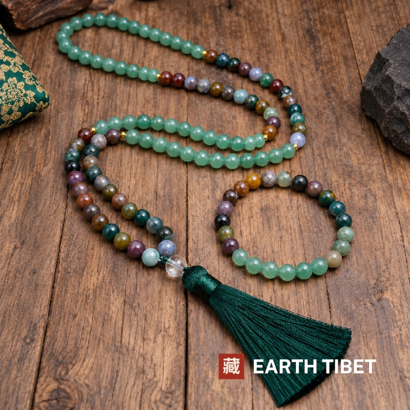 Mala with its matching aventurine and agate bracelet on a wooden table
