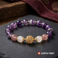Moonstone, strawberry quartz and amethyst bracelet with a gold filigree bead at the front