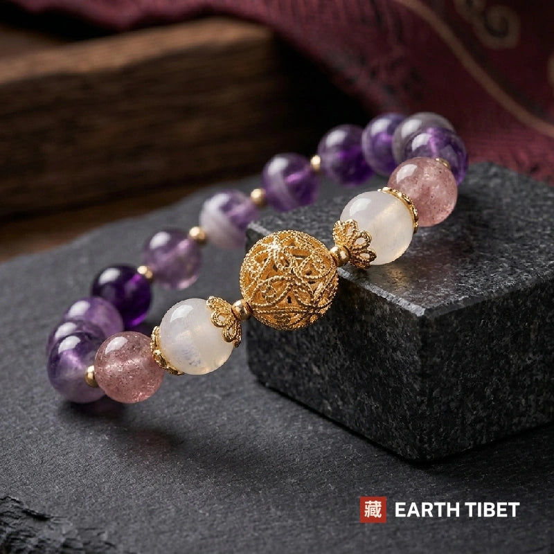 Gold filigree centre bead with lotus-petal caps between two moonstone beads