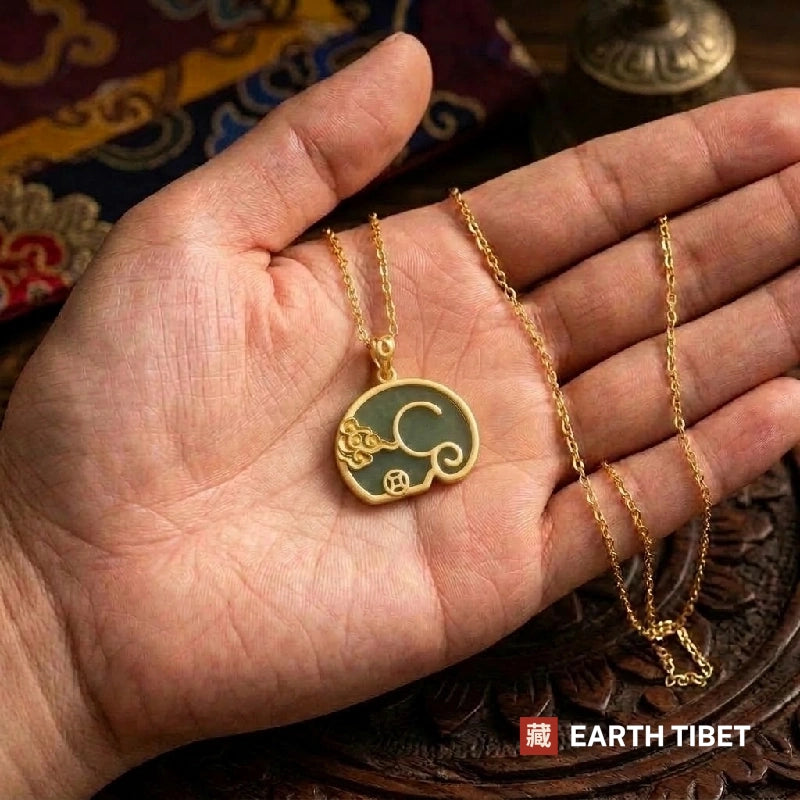 Elephant pendant lying in an open hand to show its size
