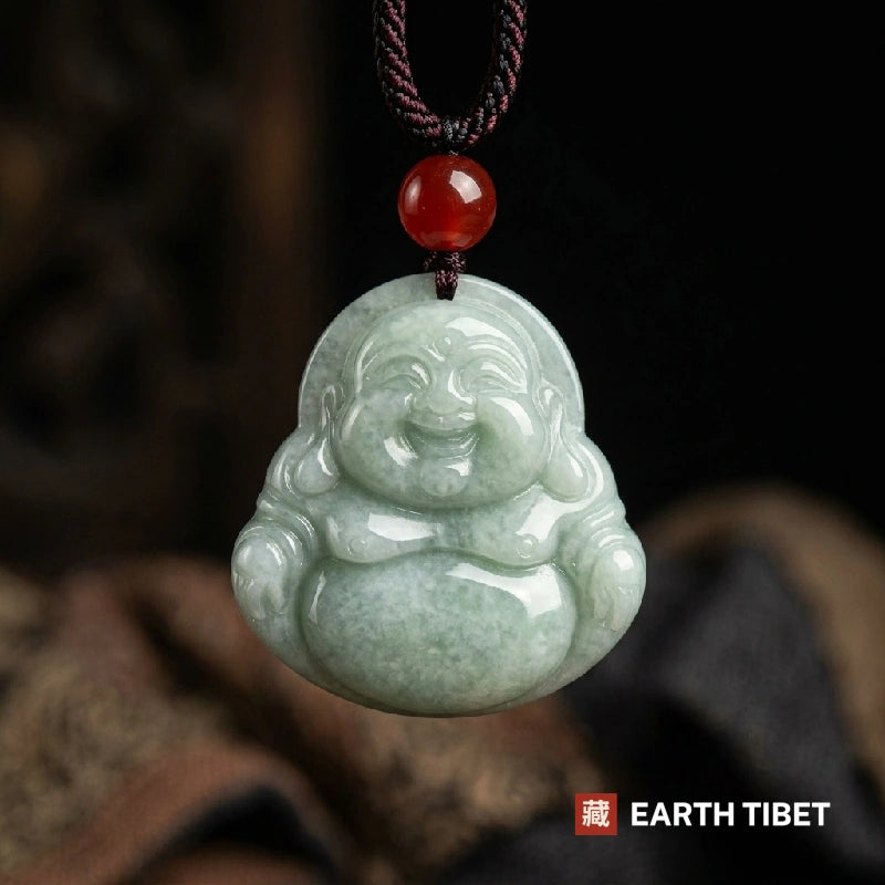 Jade laughing Buddha pendant on a braided cord with a red agate bead