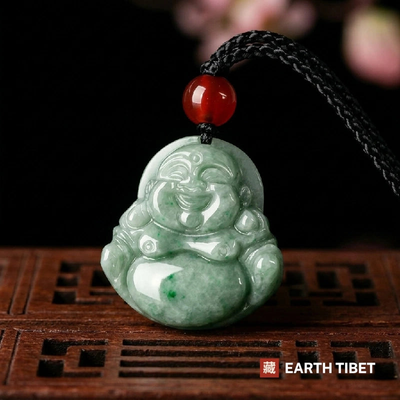 Jade laughing Buddha pendant with brighter green flecks through the belly, on a black cord