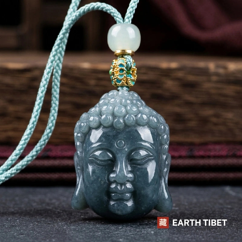 Close view of the Buddha head showing snail curls, closed eyes and the raised urna dot