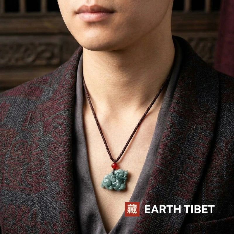 Jadeite pixiu protection necklace worn by a man over a grey robe