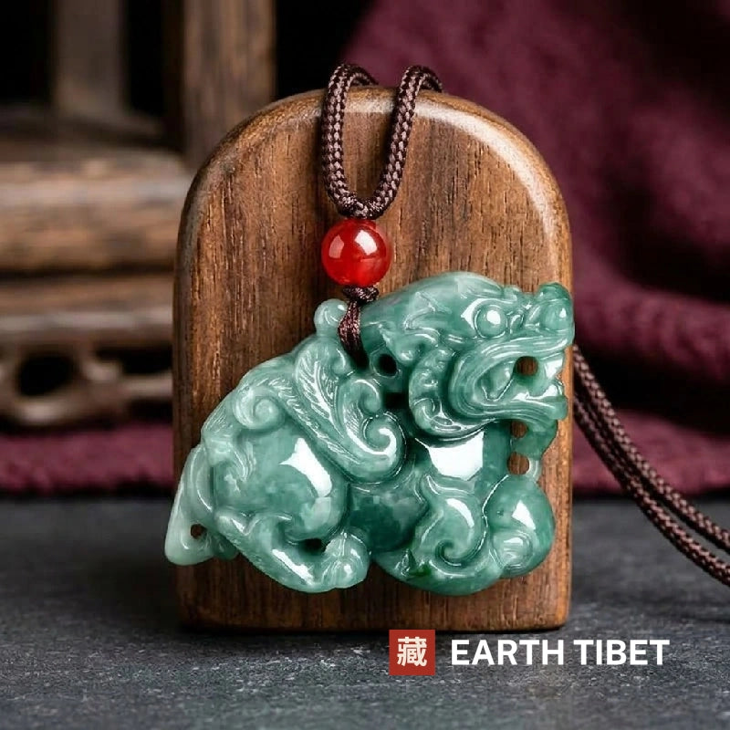 Jadeite pixiu pendant displayed against a wooden block