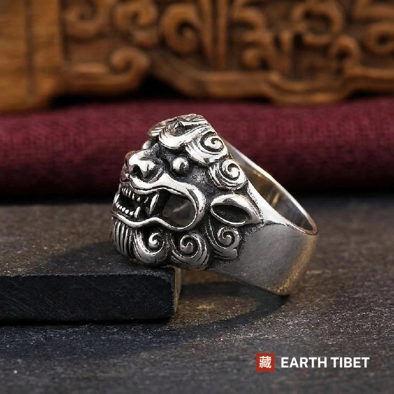 Chinese guardian lion ring in stainless steel, side view showing the spiral mane and open jaw