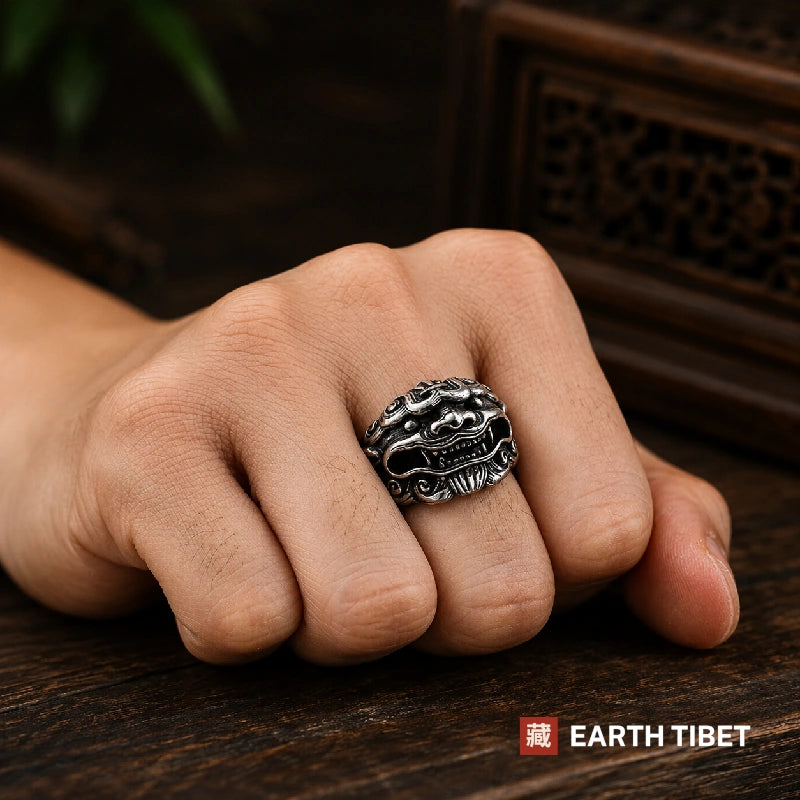 Guardian lion foo dog ring in 316L steel, showing the bulging eyes and mane spirals