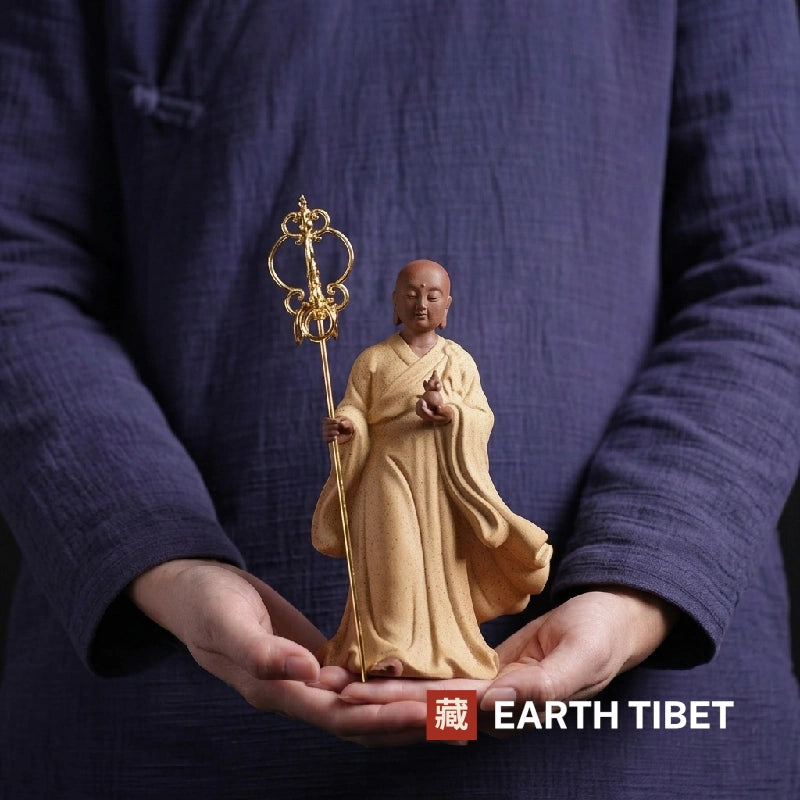 White porcelain Ksitigarbha bodhisattva statue on an altar shelf