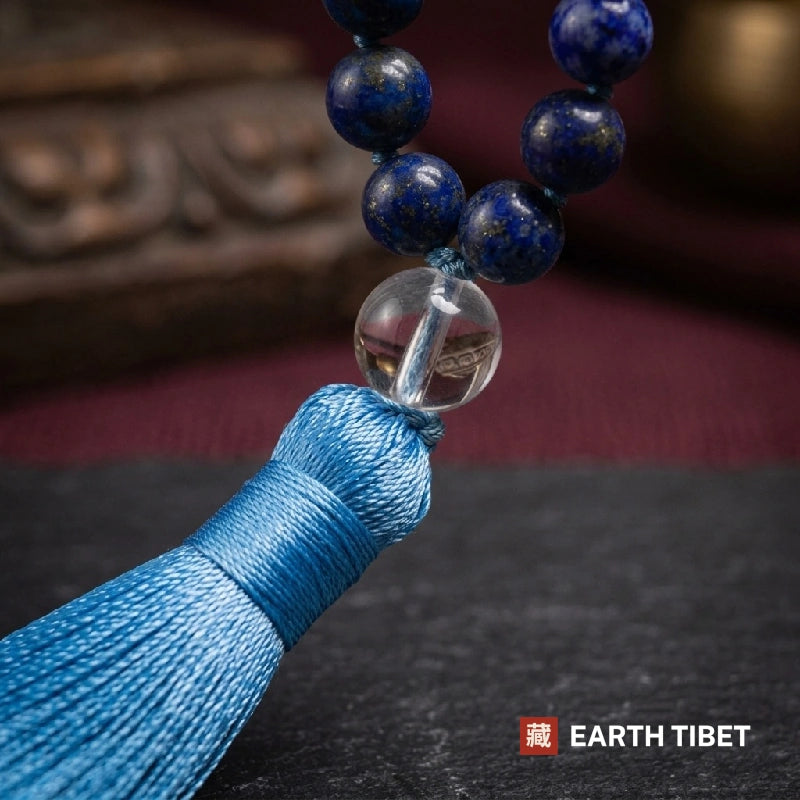 Macro of the clear quartz guru bead and lapis lazuli beads showing gold pyrite flecks