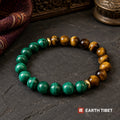 Malachite and tiger eye bracelet split half and half, divided by gold rondelles