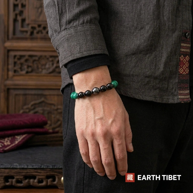Banded green malachite beads with black tourmaline and hematite disc spacers