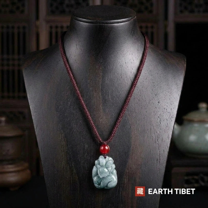 Nine-tailed fox jade necklace on a display bust showing where the pendant sits