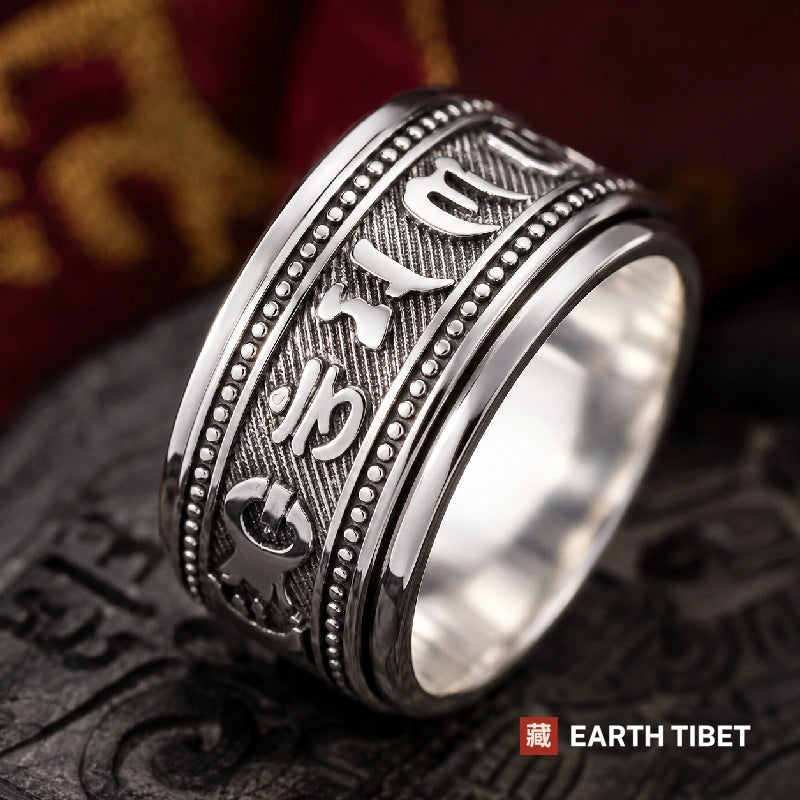 Om mani padme hum spinner ring, angled view of the raised Tibetan lettering