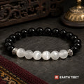 Black onyx and selenite balance bracelet in 8mm beads on slate